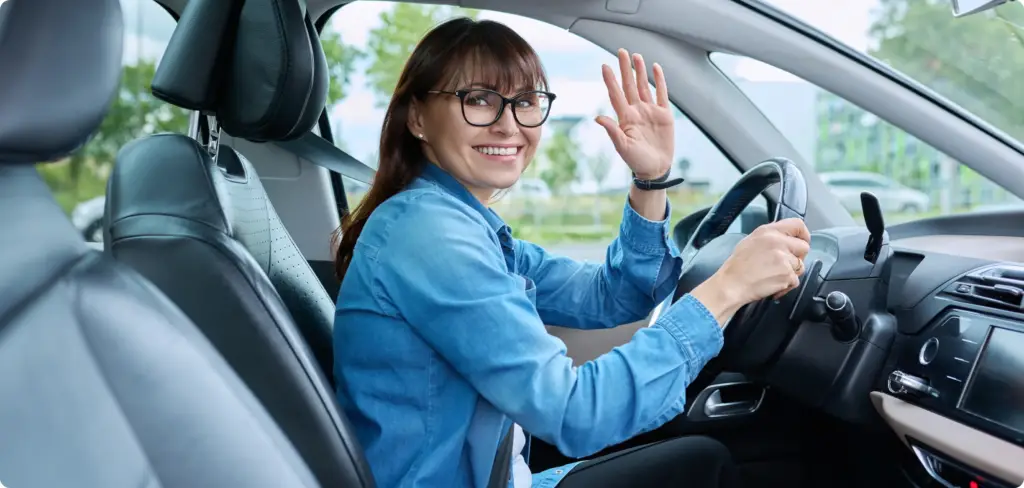 Why the Traditional Auto Repair Model Is Broken — And What Drivers Can Do About It Image of a woman happy and smiling after her mobile service from her - on-demand car service by Revilo Auto Care