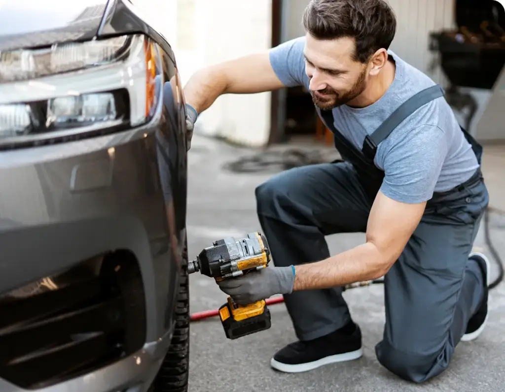 Become a Provider Mobile mechanic performing tire change service by Revilo Auto Care