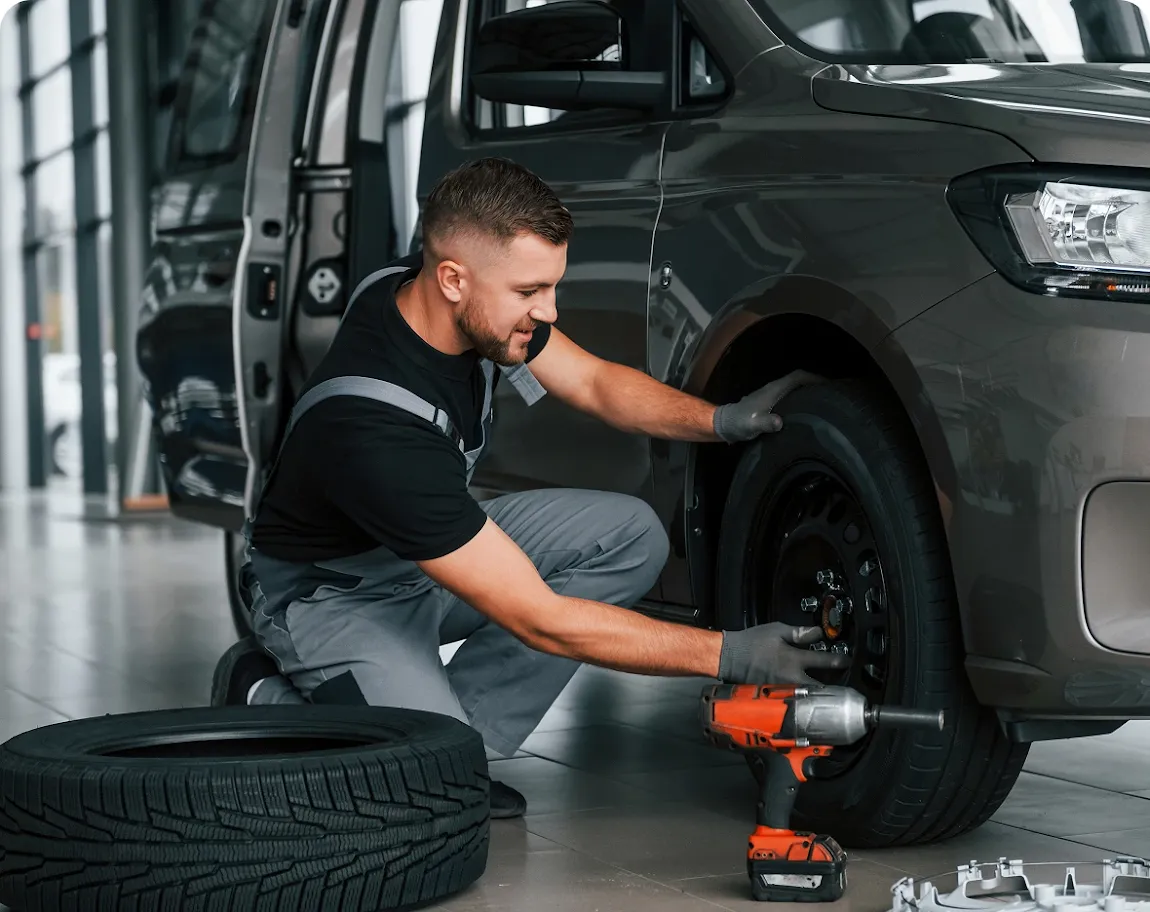 Mobile mechanic performing tire change service by Revilo Auto Care